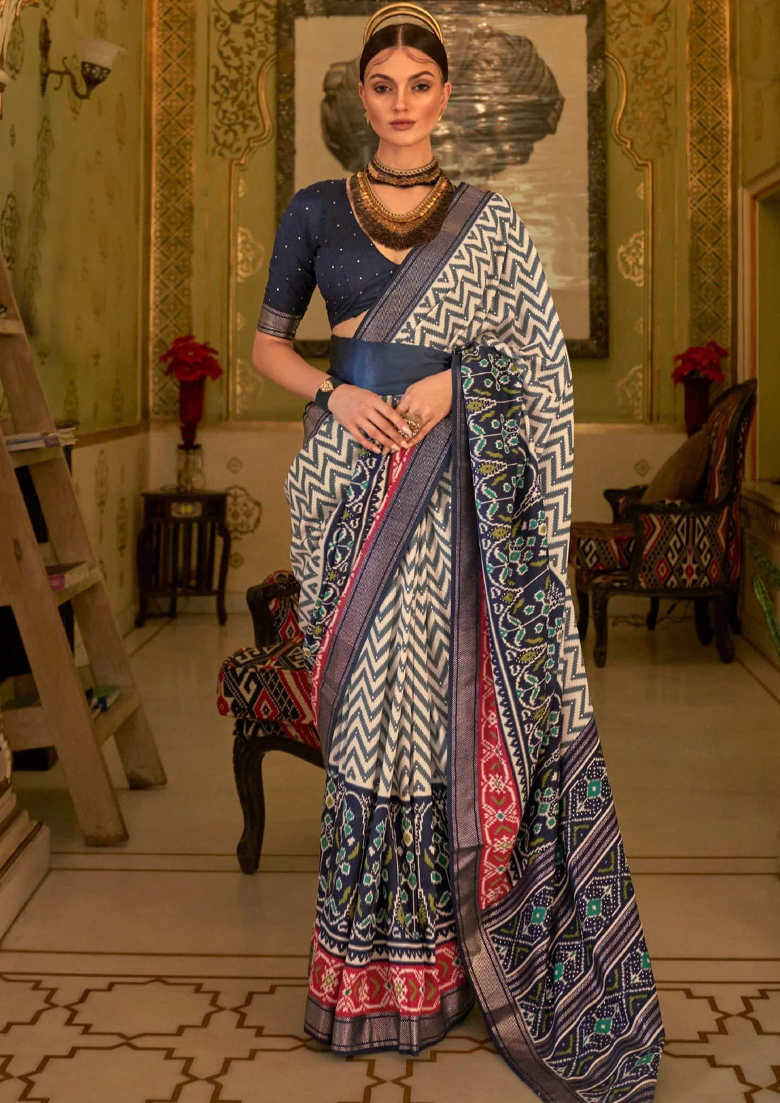 Double ikkat patola silk blue saree online in india for wedding.