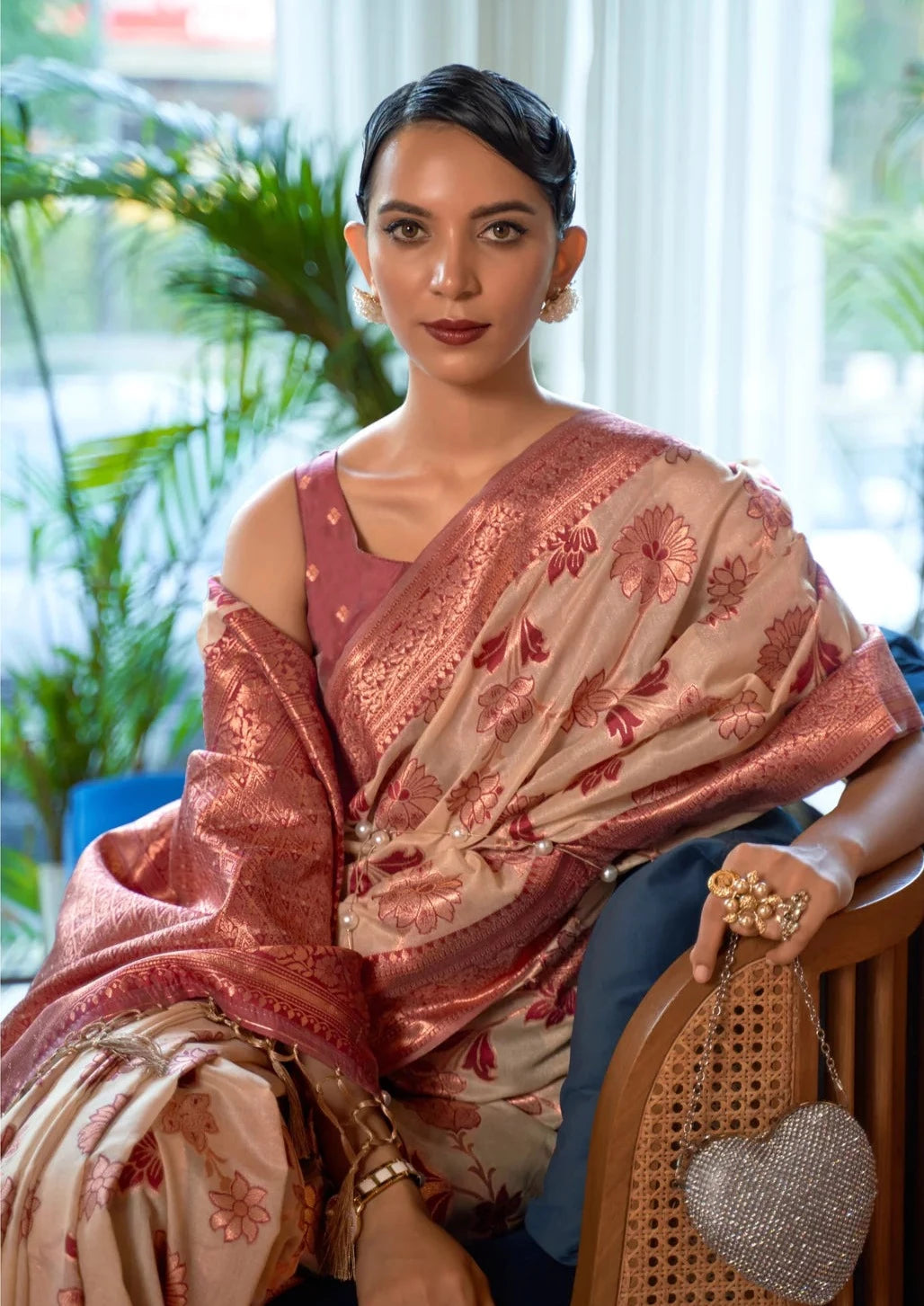 Woman in pure banarasi organza zari work cream saree blouse.
