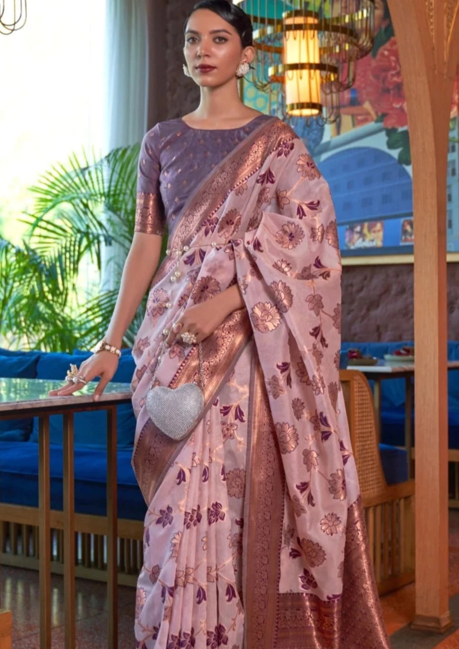 Woman in pure banarasi organza handloom saree in lilac purple color.