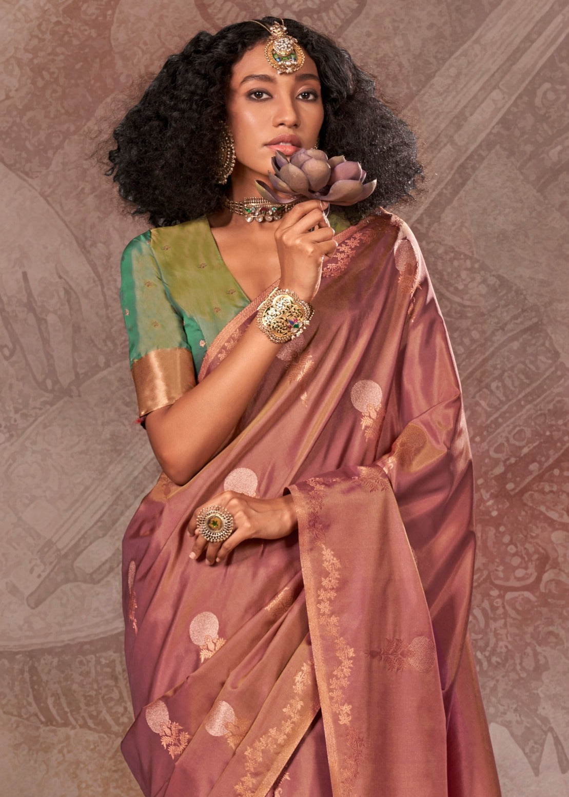 Premium soft handloom banarasi silk brown saree with detailed gold weaving and a vibrant green blouse, showcasing traditional Indian craftsmanship.