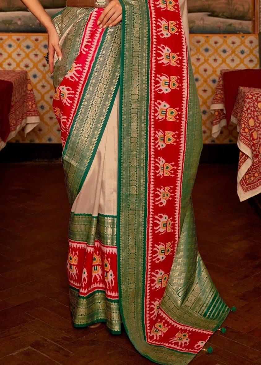 Traditional patola silk saree in cream green for Indian wedding wear across USA and New York.