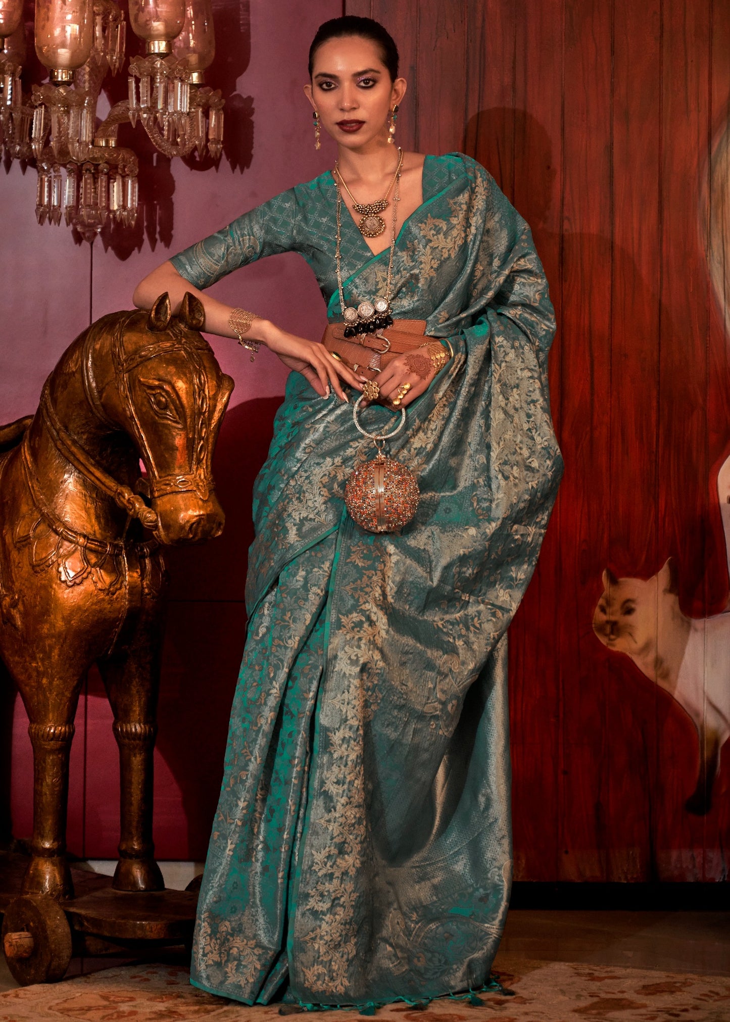 Close-up of banarasi handloom silk turquoise blue saree online in india, usa with intricate traditional motifs.