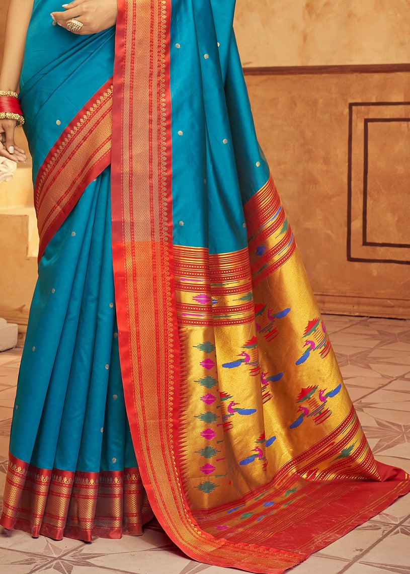 Turquoise blue paithani silk saree online with red and gold zari weaving border.