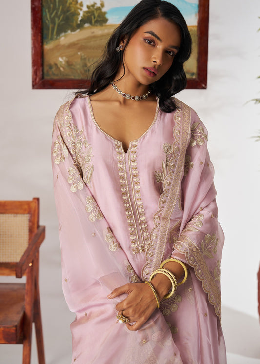 Pure organza pastel pink unstitched salwar suit set online in usa showcasing intricate hand embroidery work on soft pastel color.