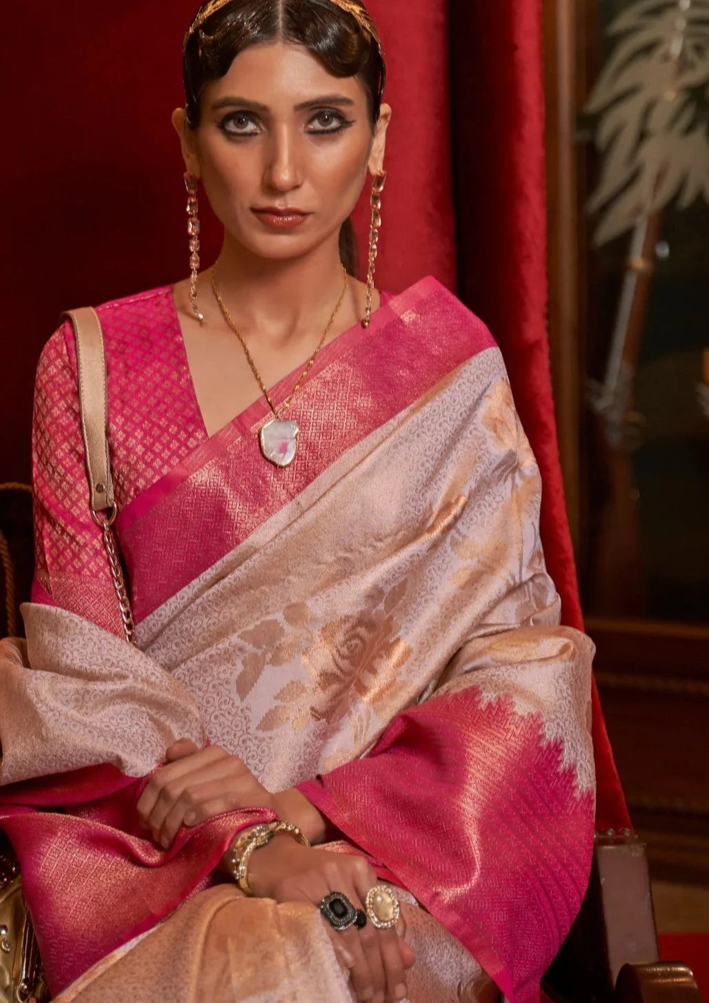 woman in white kanjivaram silk saree and pink blouse
