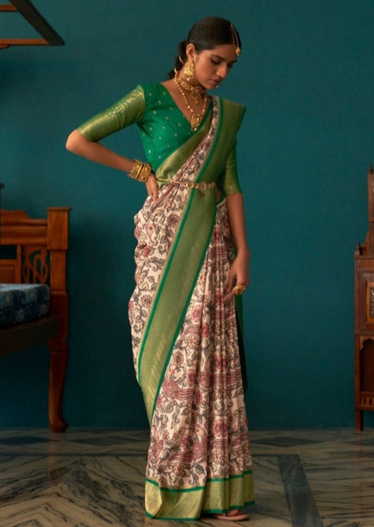 Woman standing in white and green saree