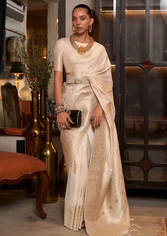 Bride in white khaddi georgette banarasi saree blouse with silver zari work.
