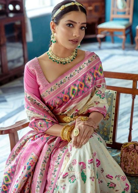 Stylish fusion banarasi patola silk saree in off white with detailed paithani border and pallu, paired with contrast pink blouse.