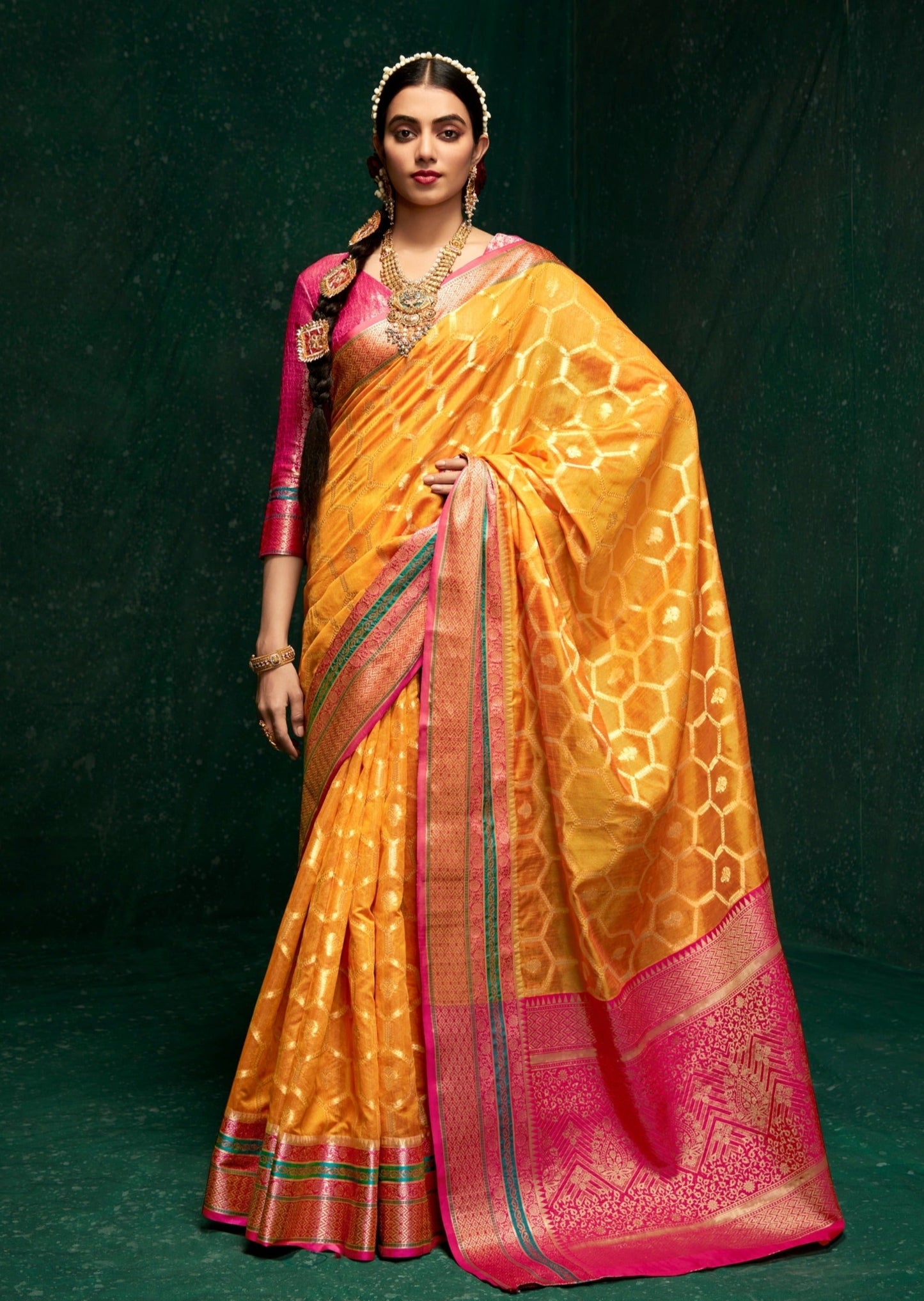 Woman standing in Yellow color cotton silk saree