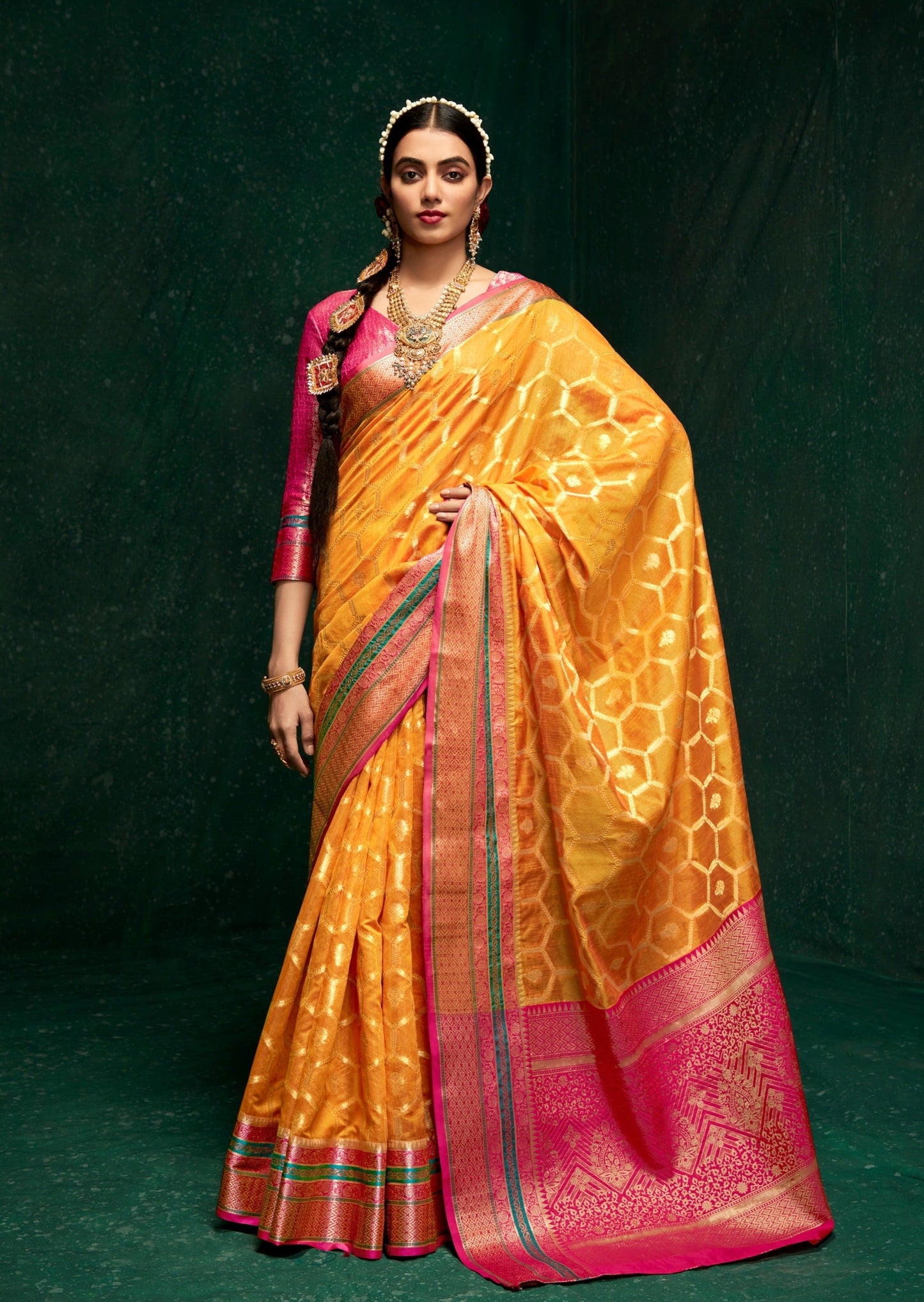 Woman standing in Yellow color cotton silk saree