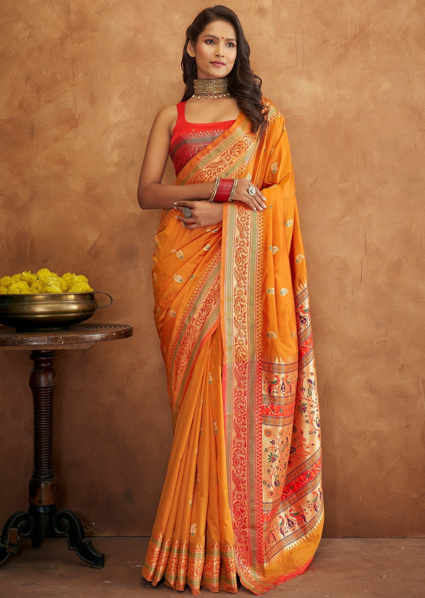 Yellow handloom paithani silk saree online with contrast red blouse.