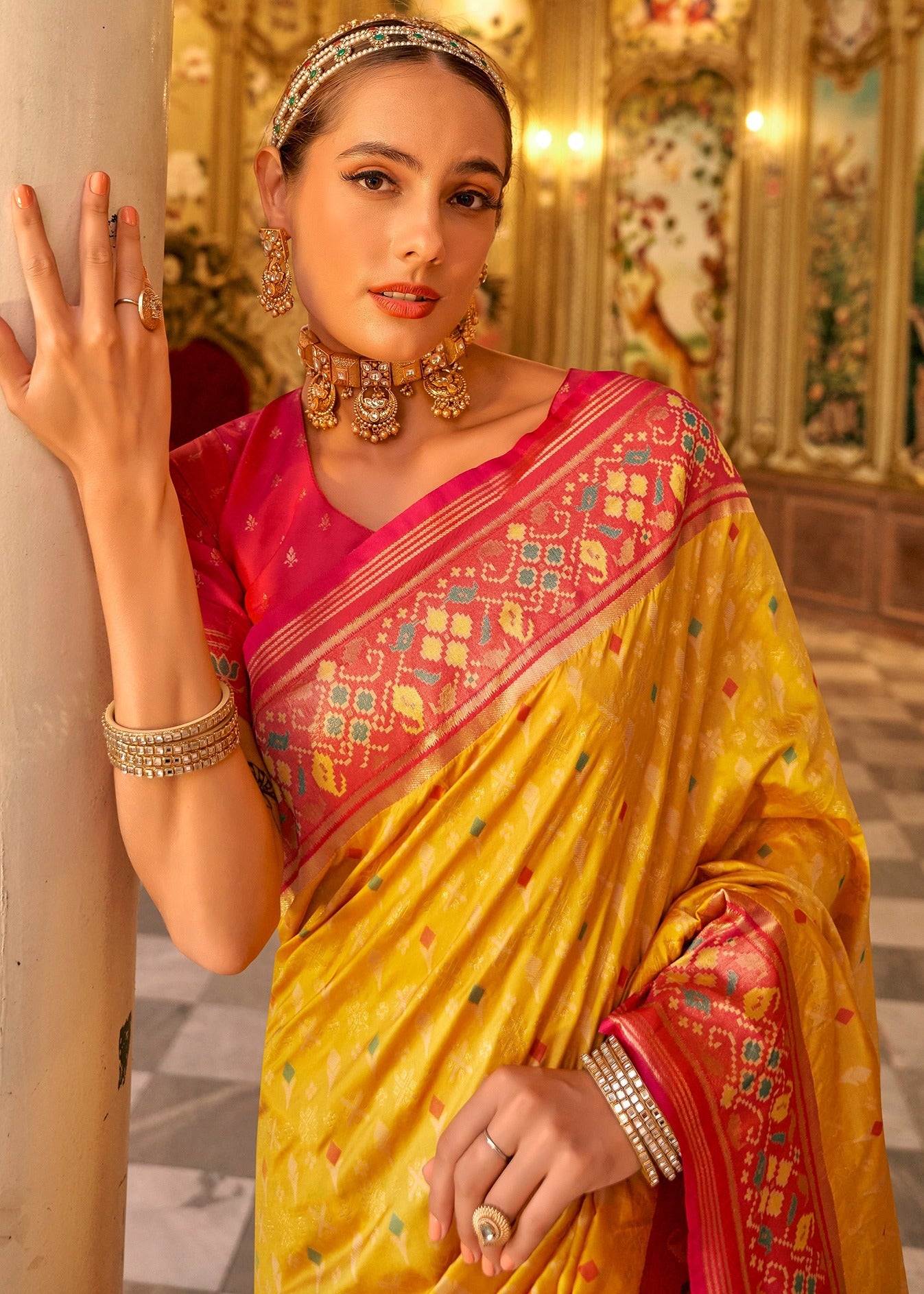 Shop yellow patola silk handloom saree with contrast red blouse online in usa.