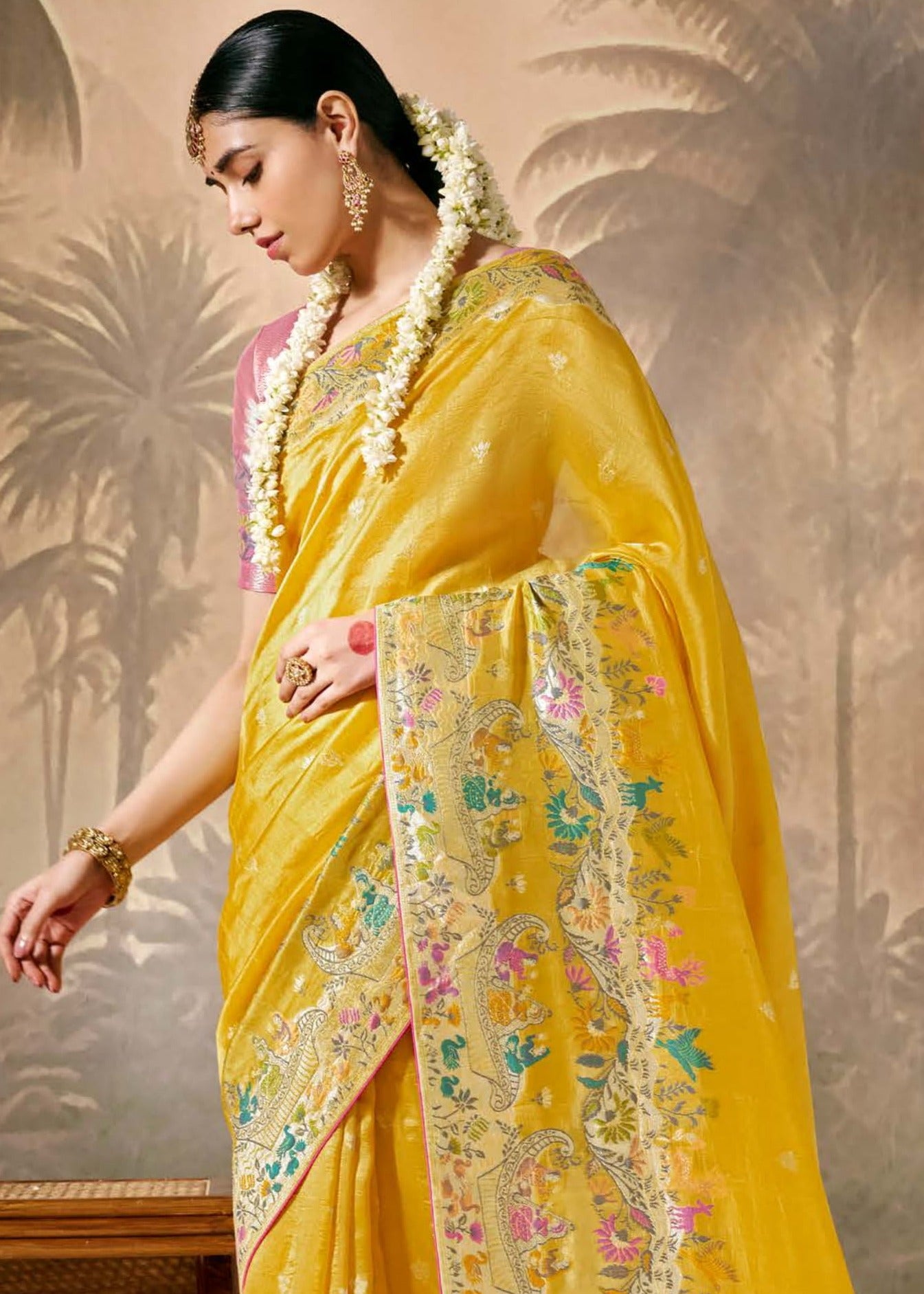 Yellow and pink banarasi silk bridal saree online for haldi look.