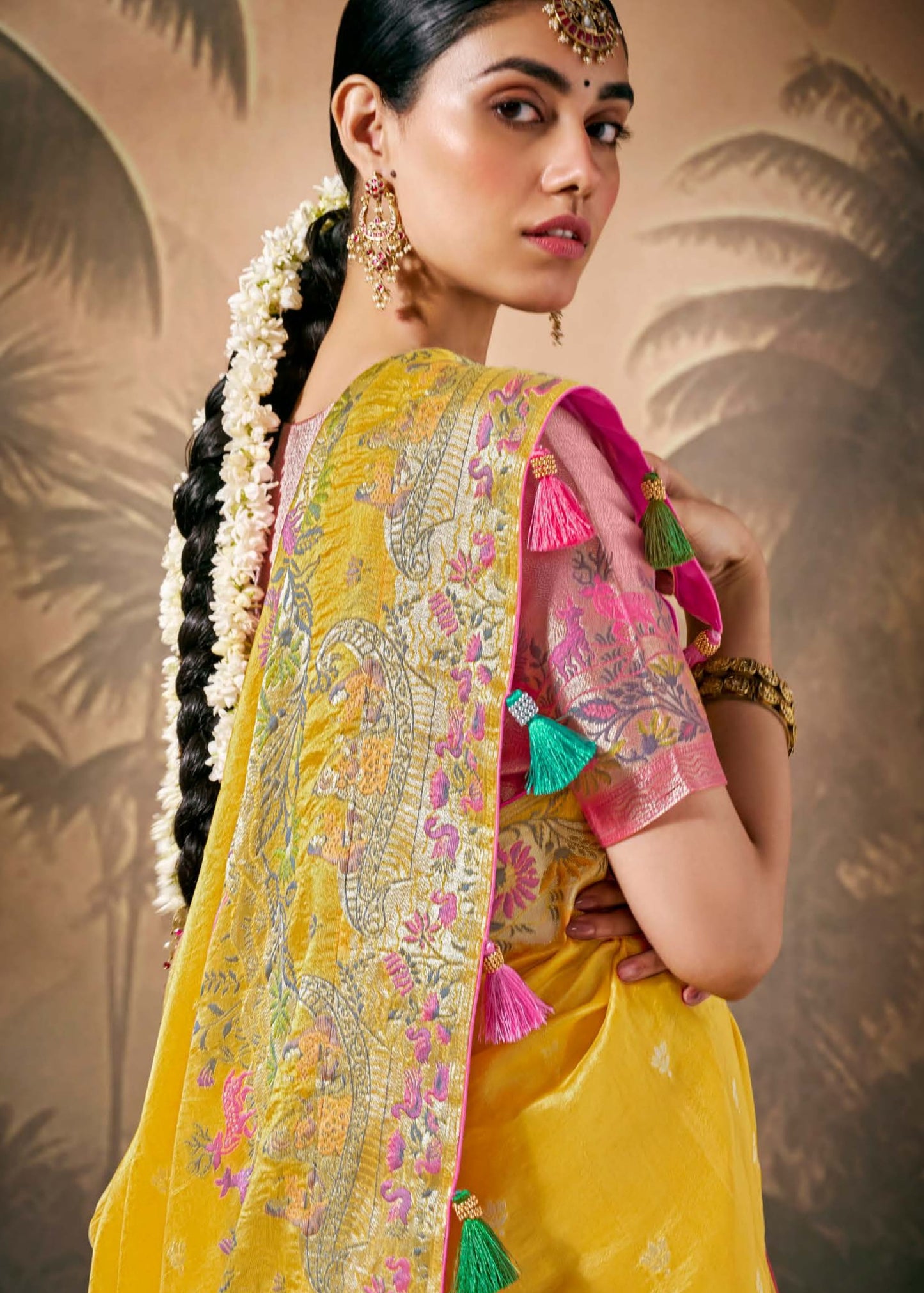 Yellow banarasi silk saree with gold zari border online for haldi ceremony.