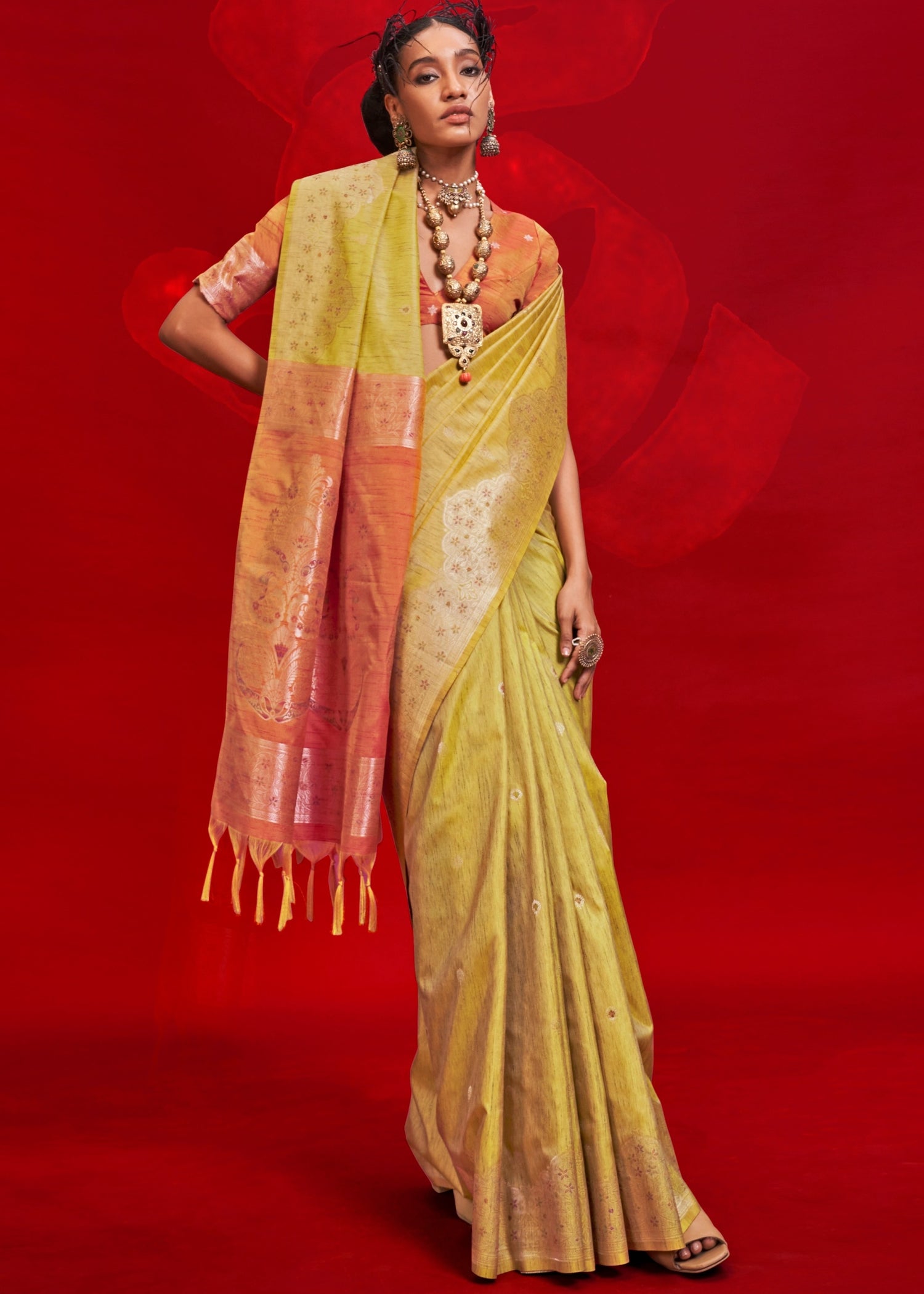 Traditional pure handloom yellow tussar silk saree online with contrasting orange blouse.