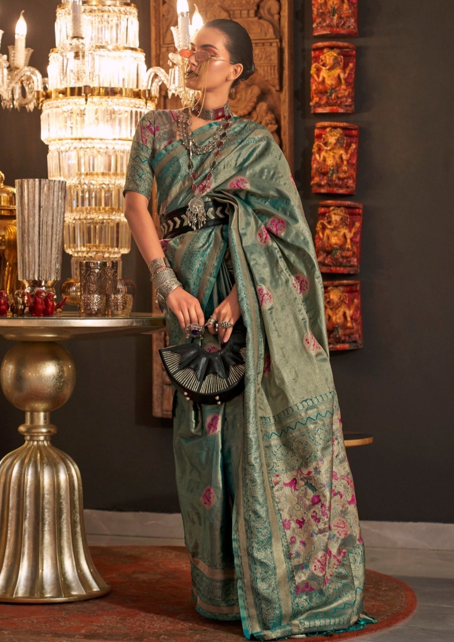 Woman in pure handloom banarasi silk blue zari saree blouse.