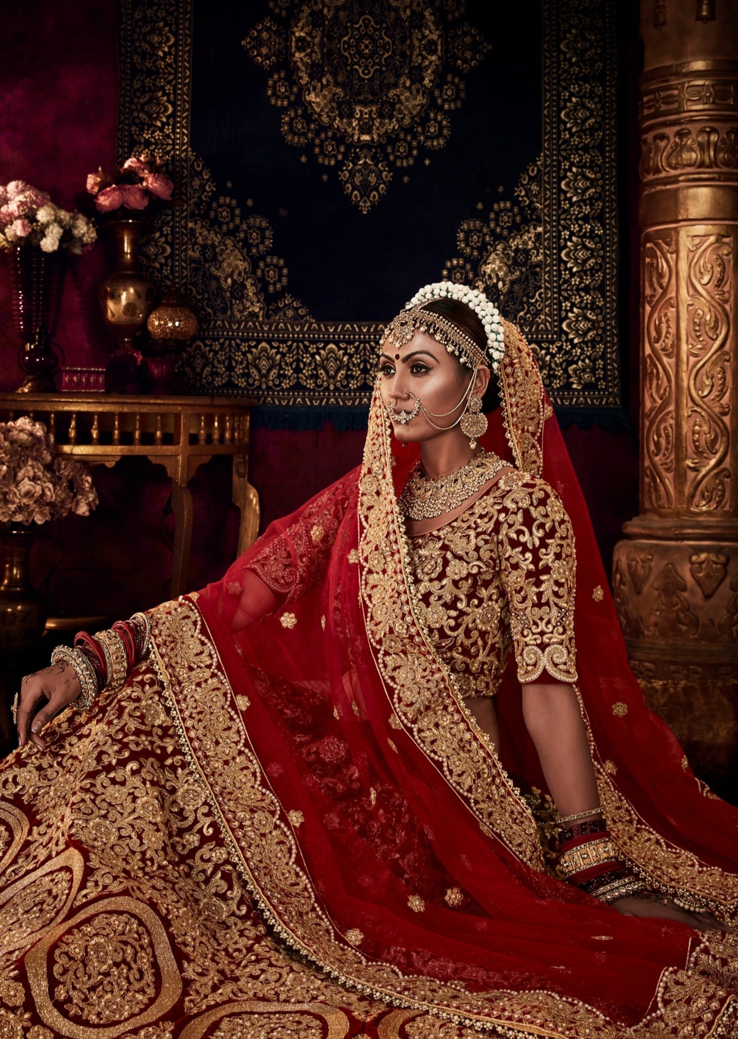 Buy Red lehenga set with shawl and veil by Sabyasachi at Aashni and Co