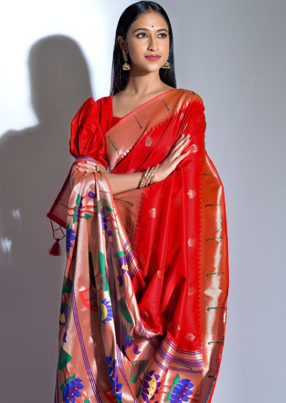 Woman wearing traditional Red Paithani saree