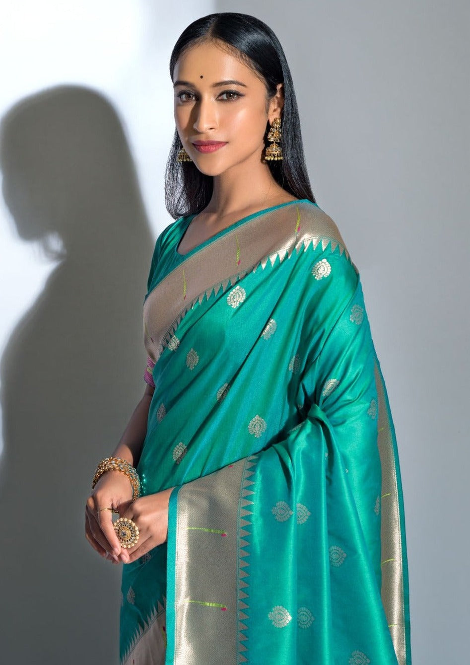Green banarasi silk saree online with golden zari border.