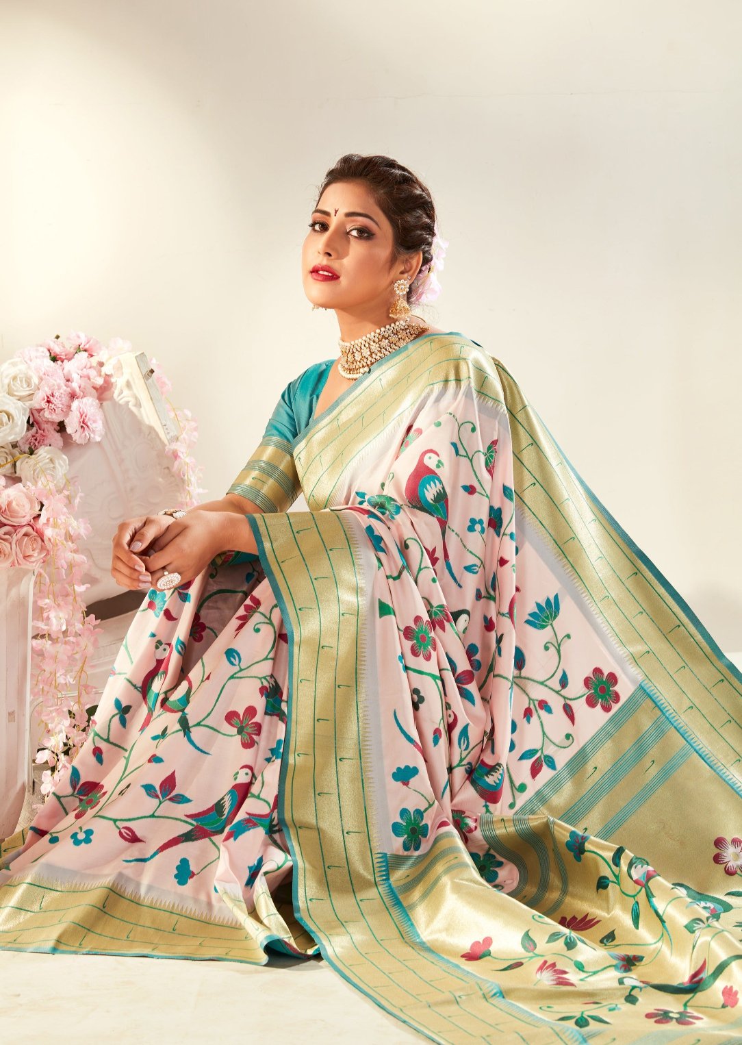 Light baby pink pure paithani silk saree online in india usa uk with contrast blue blouse.