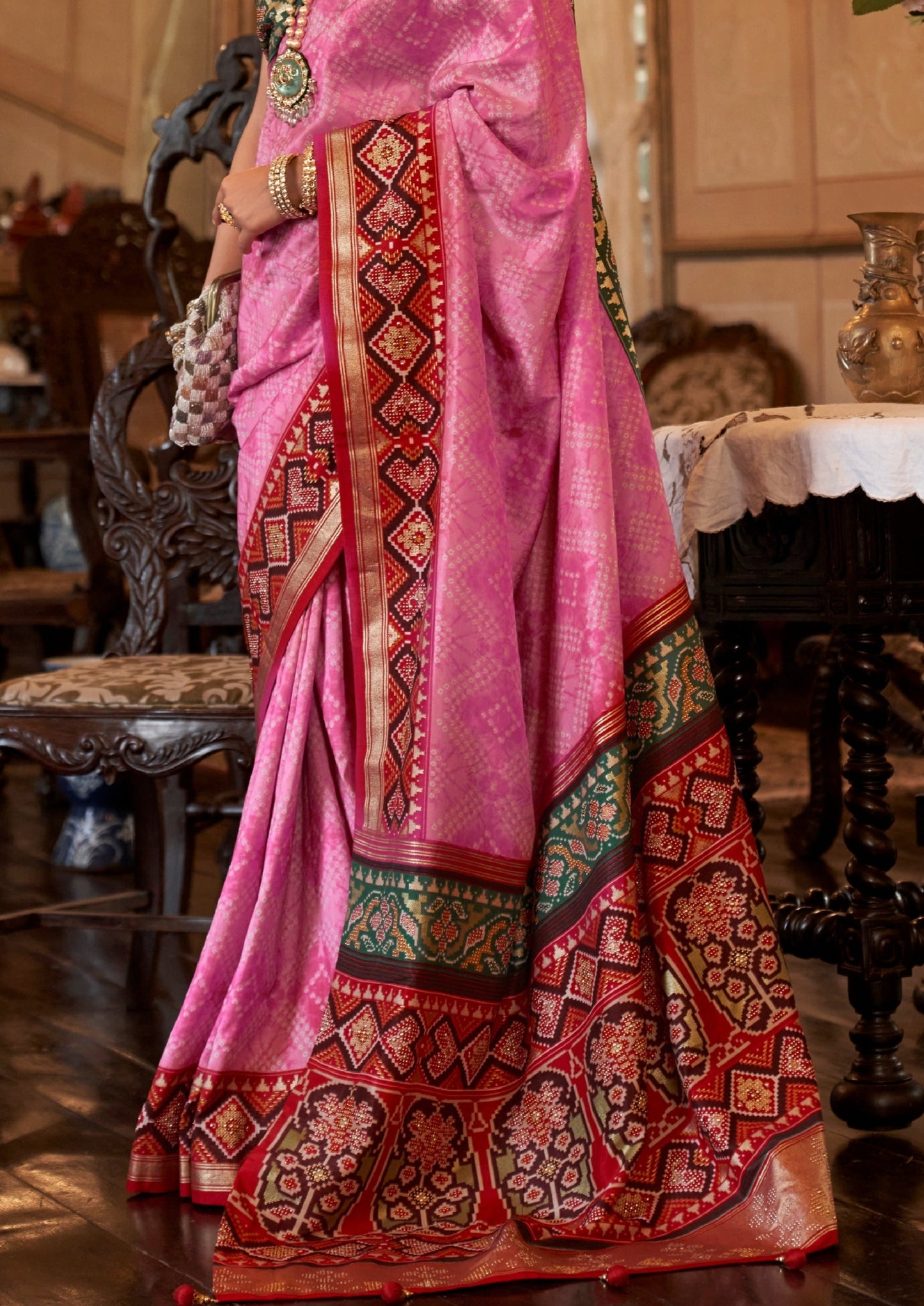 Double Ikkat patola and bandhani pink fusion saree design.