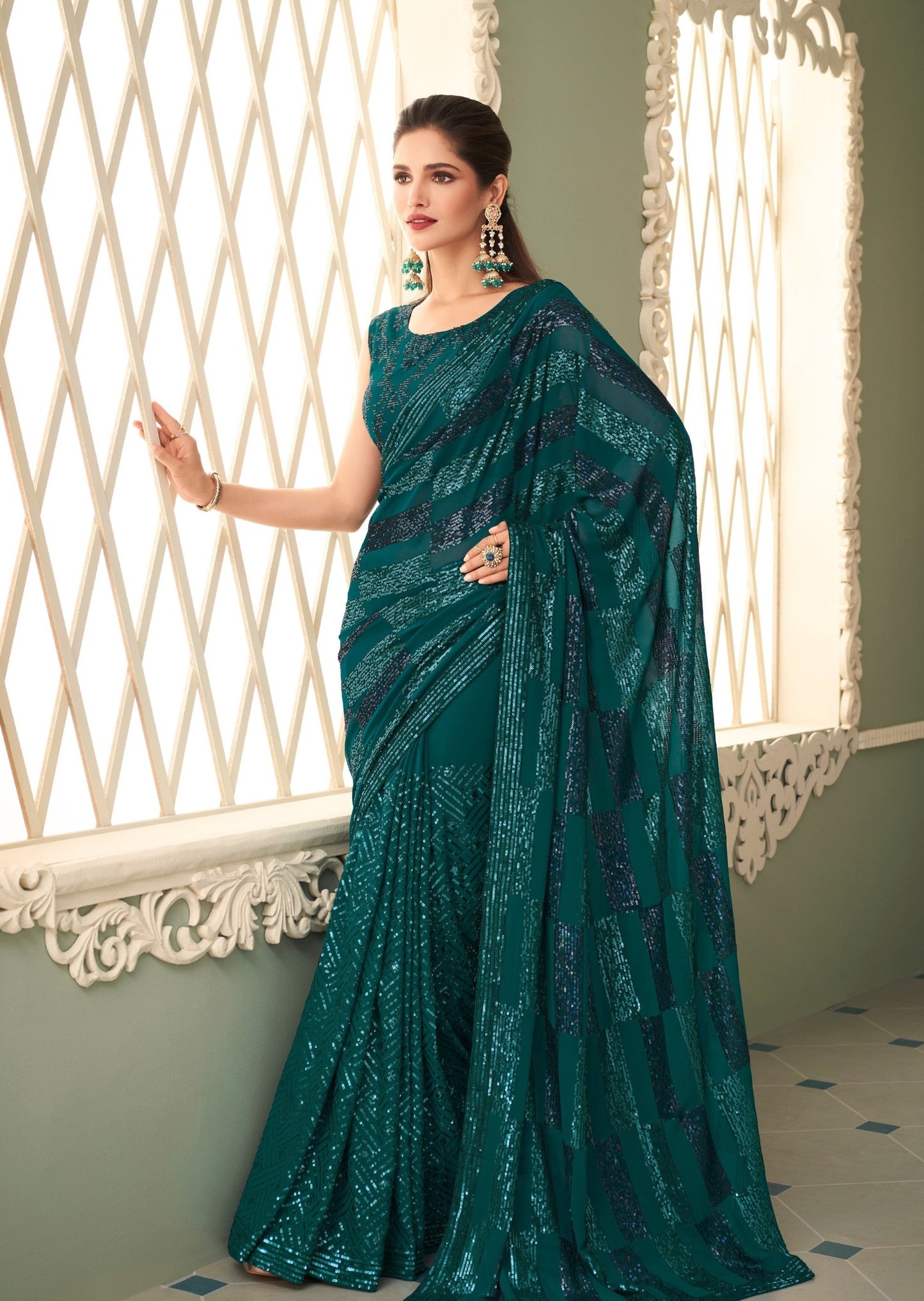 Woman wearing Green Georgette Sequins saree