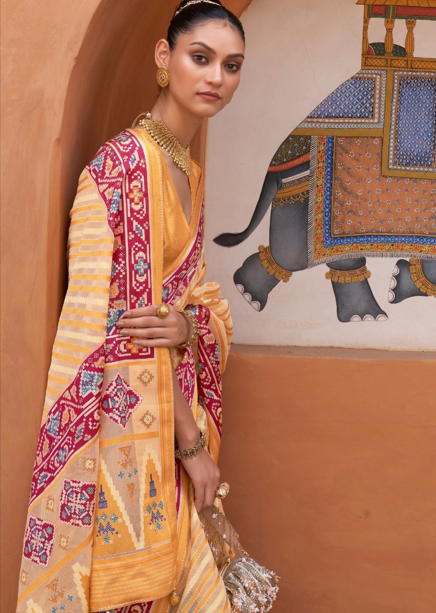 Girl wearing Double Ikkat Patola Yellow saree