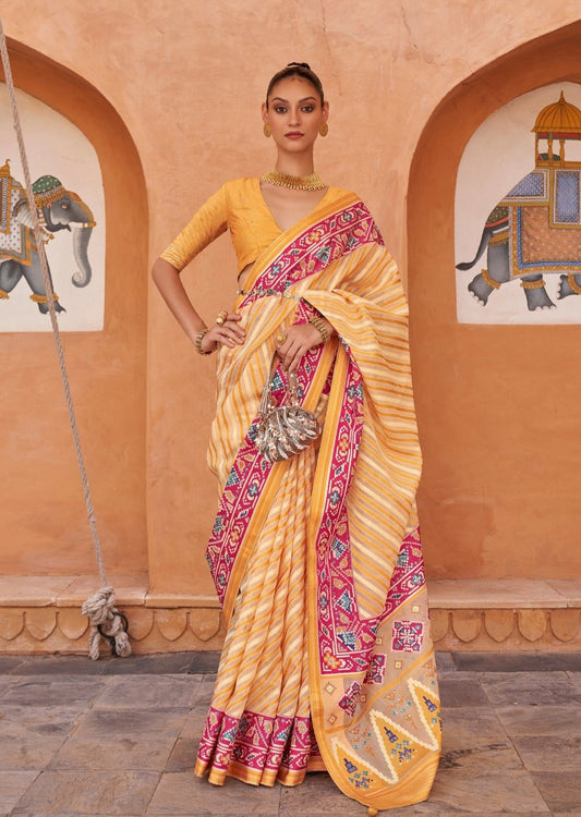 Woman's ikkat patola yellow saree online usa in pure tissue silk at best price.