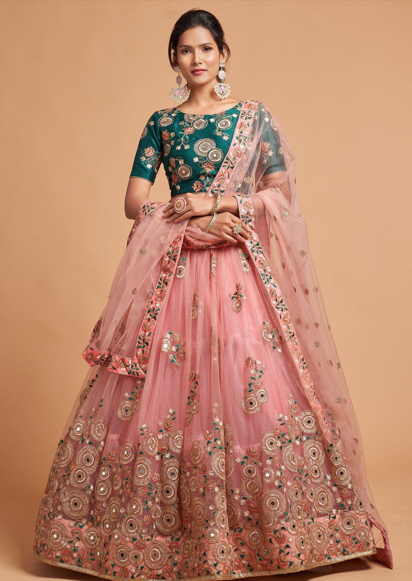 Shop indian bridal wedding lehenga in usa online featuring a light pink skirt and dupatta paired with a green blouse.