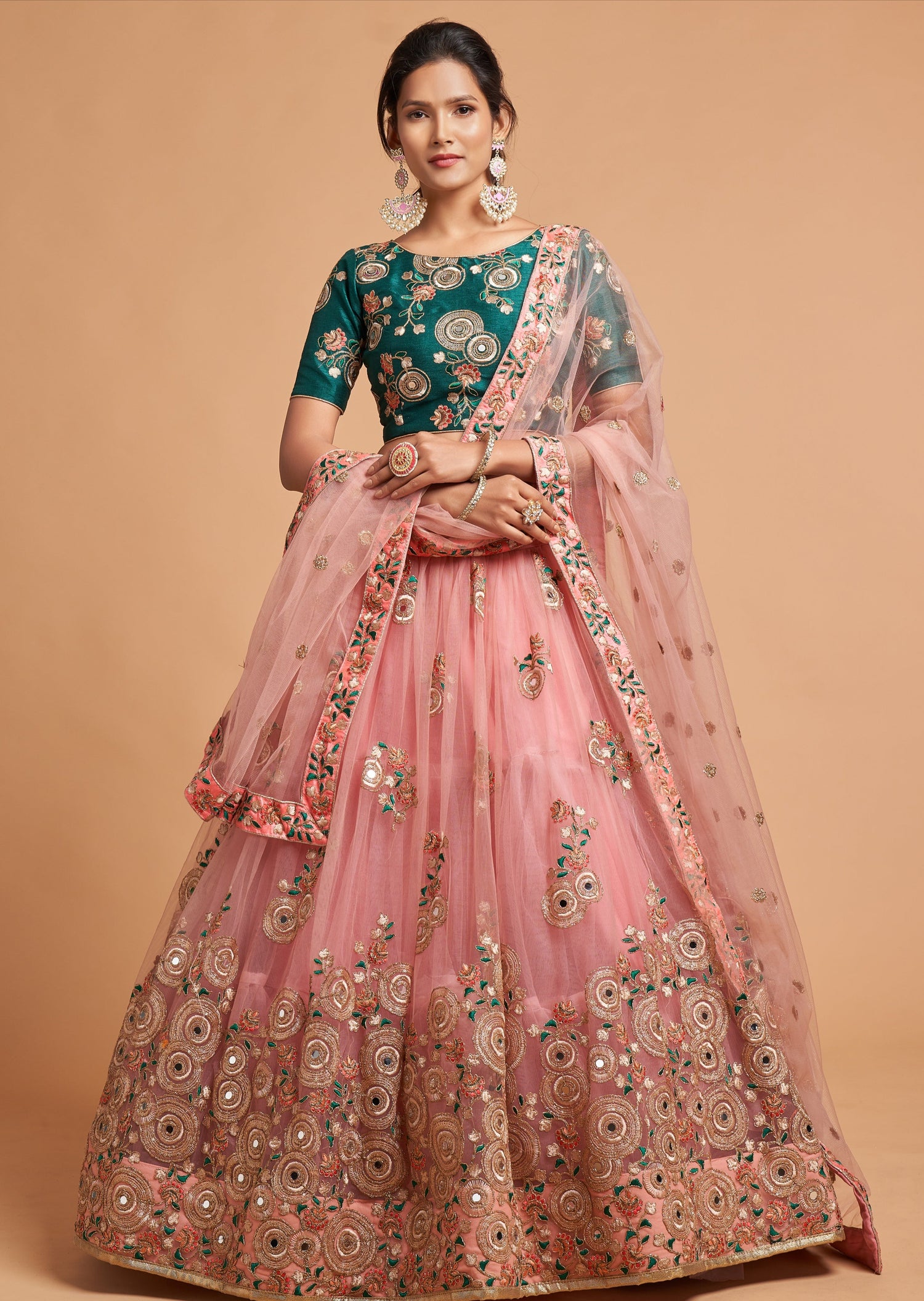 Shop indian bridal wedding lehenga in usa online featuring a light pink skirt and dupatta paired with a green blouse.