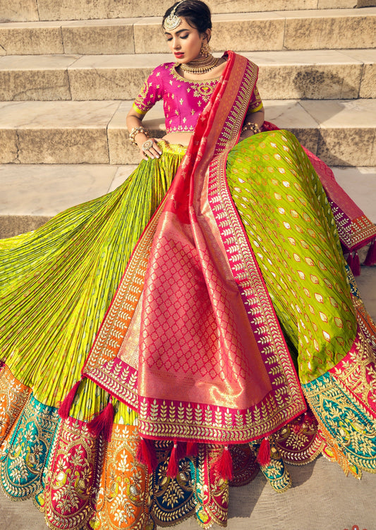 Lime green banarasi silk lehenga choli set for women paired with contrast pink blouse available for online shopping in usa, uk, canada and india.