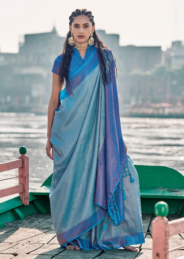 Kanjivaram silk saree online in pastel blue with pure handloom zari weaving featuring intricate copper and gold zari.