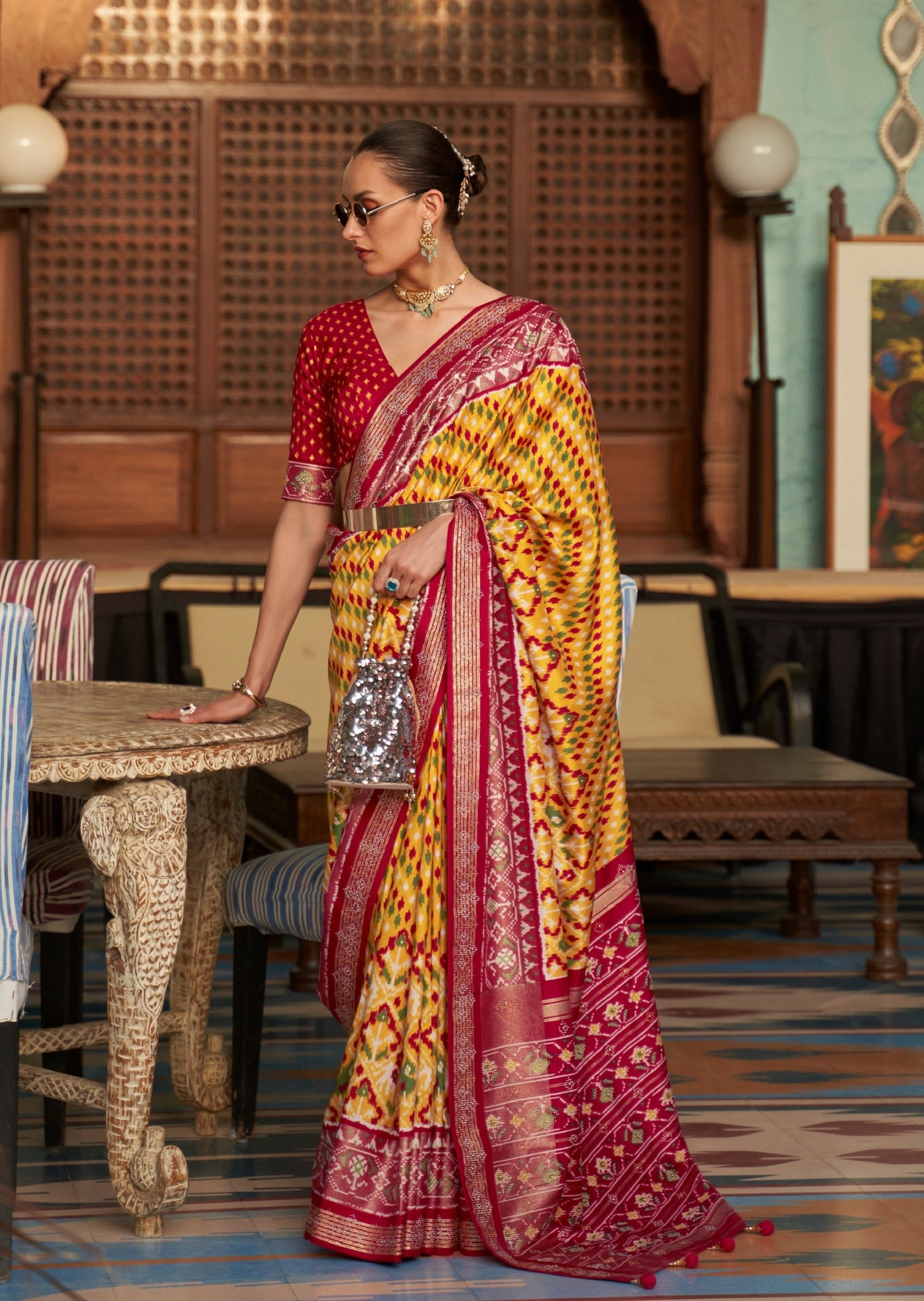 Lady wearing Patan Patola Silk Yellow Saree