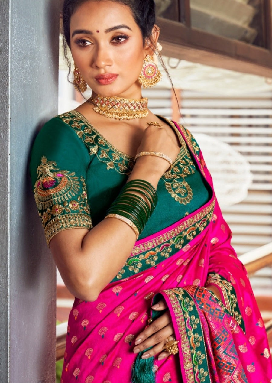 Cheshire pink banarasi dola silk saree with intricate embroidered border paired with green blouse for indian weddings in america usa.