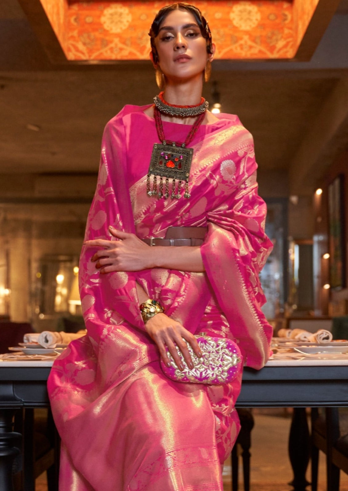 Luxurious banarasi silk pink saree featuring beautiful zari weaving and timeless traditional design.