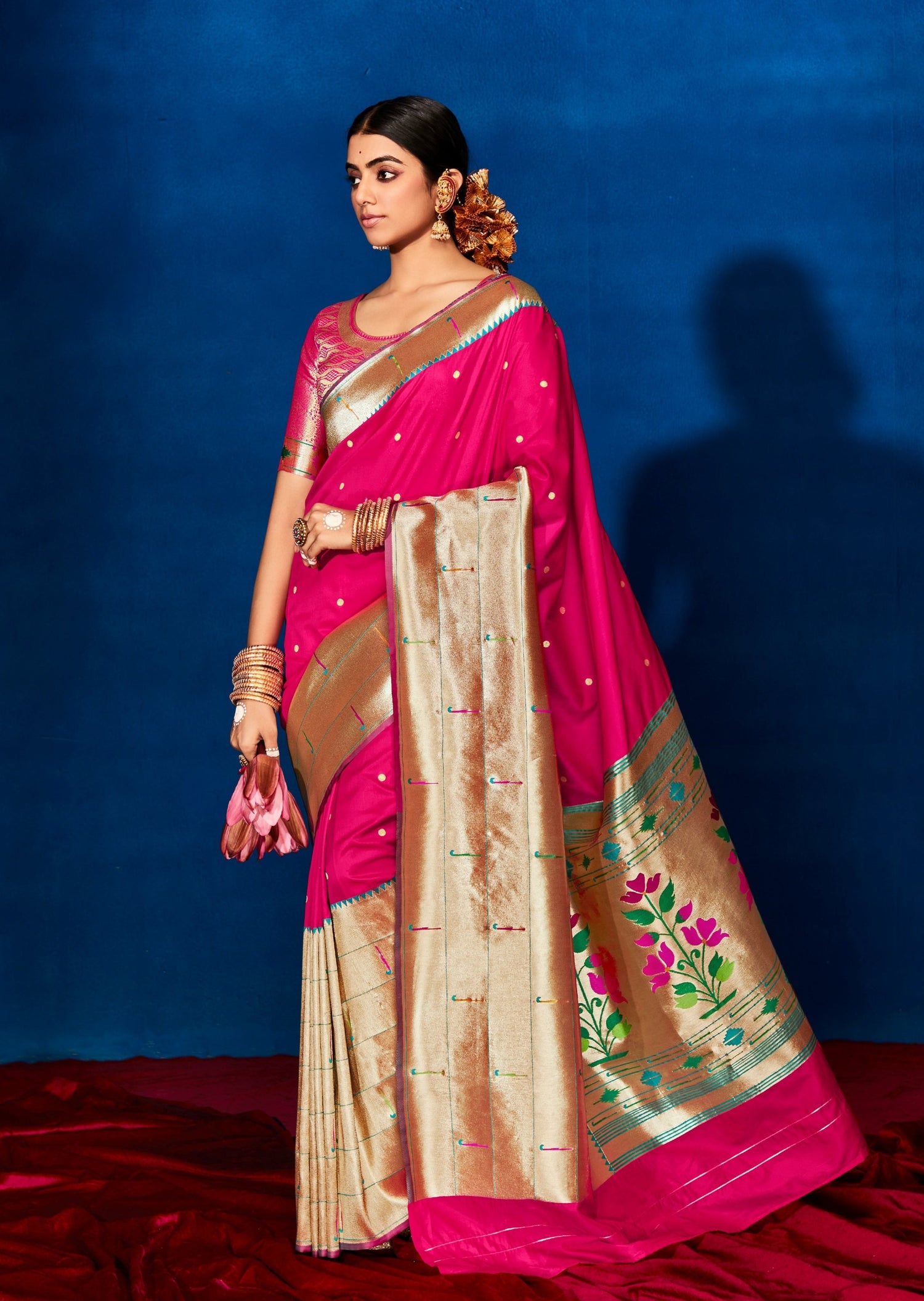 Woman wearing pink Paithani saree
