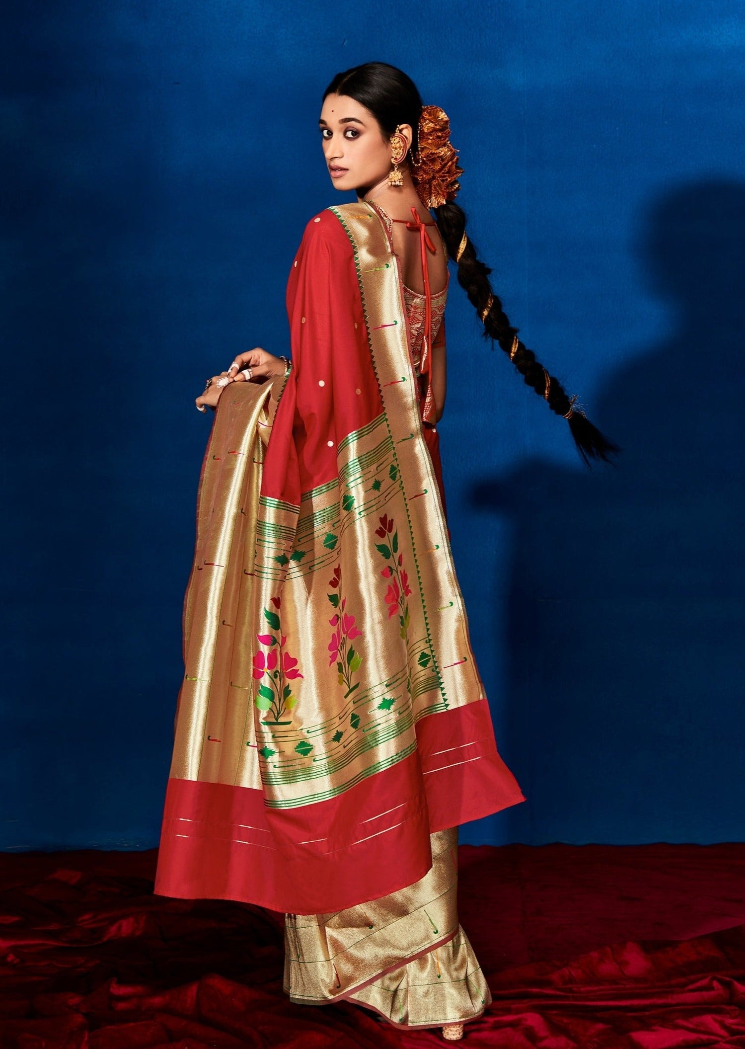 Woman wearing Red Paithani Silk Saree