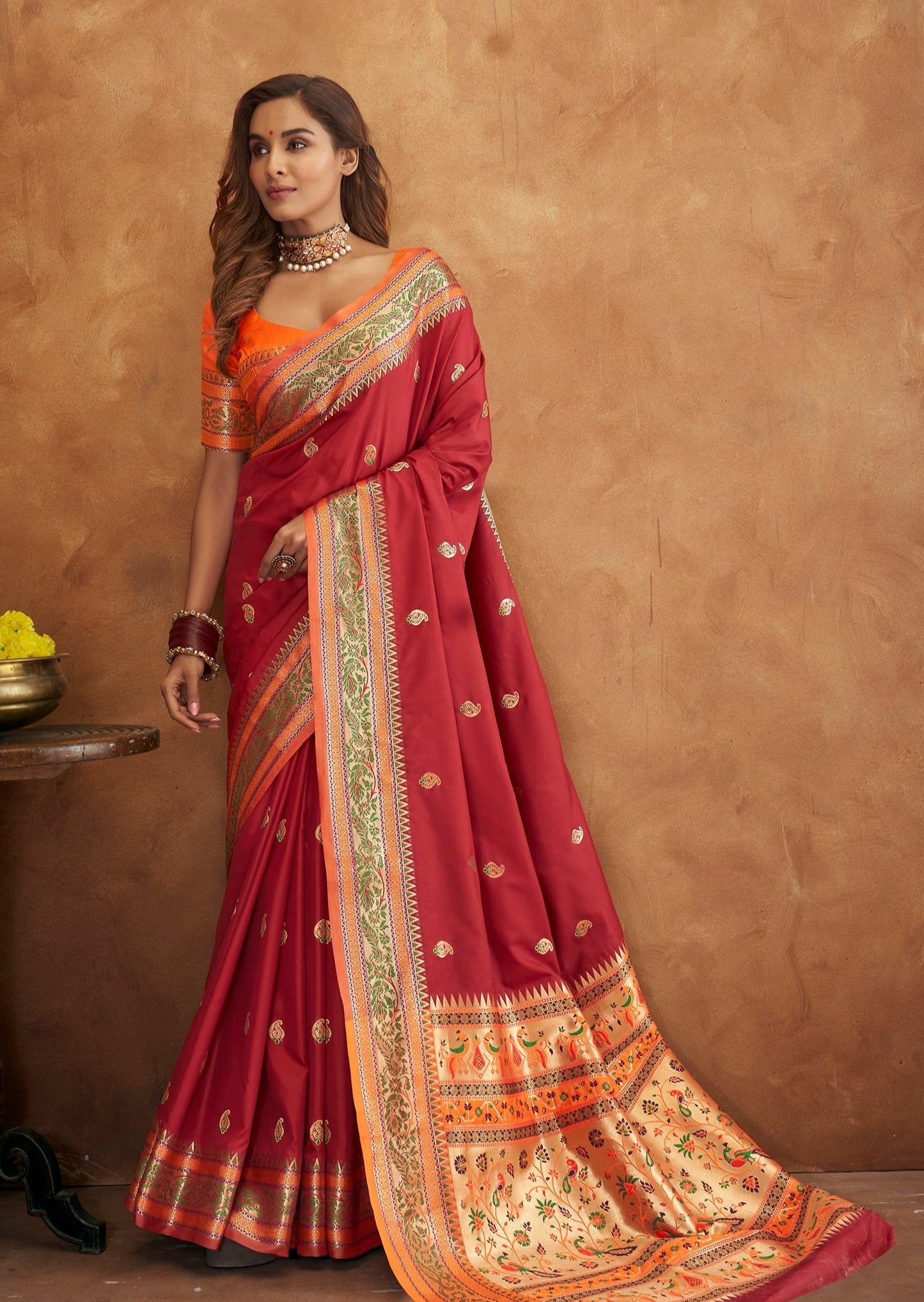 Red handloom paithani saree with zari border and orange blouse available for online shopping for wedding.