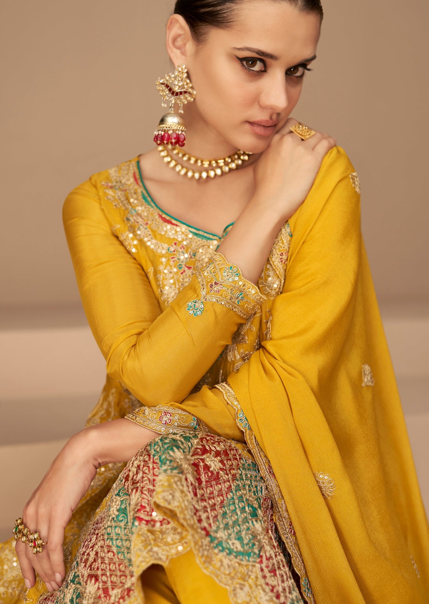 Women in heavy neck design yellow silk bridal suit