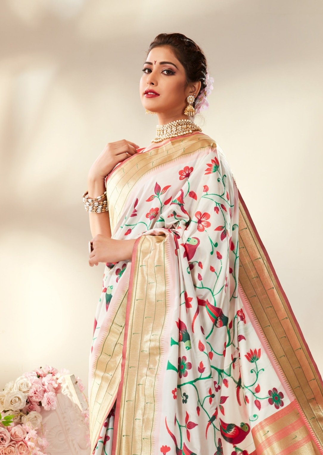 White handloom paithani silk saree online with contrast peach pink blouse for bride.