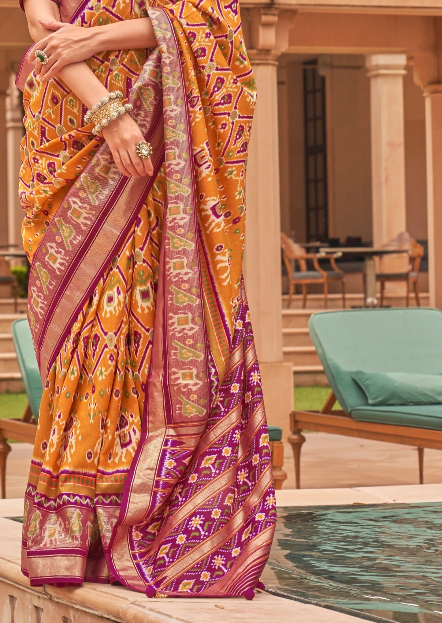 Yellow Double ikat patola saree pallu designs online shopping for wedding.